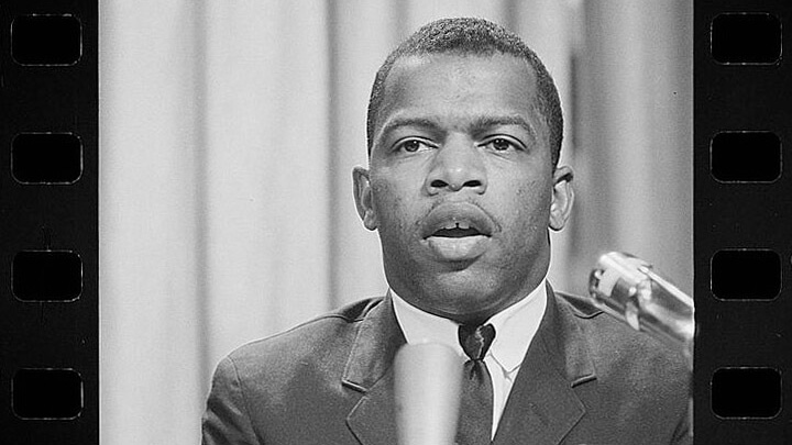 John Lewis speaking into a microphone.