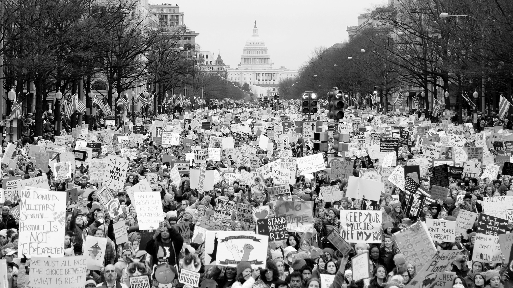 A protest happening in Washington, D.C. in black and white.