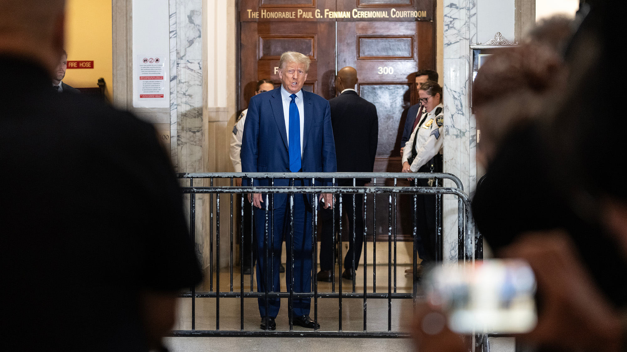 Donald Trump addressing the press outside a courtroom in New York.
