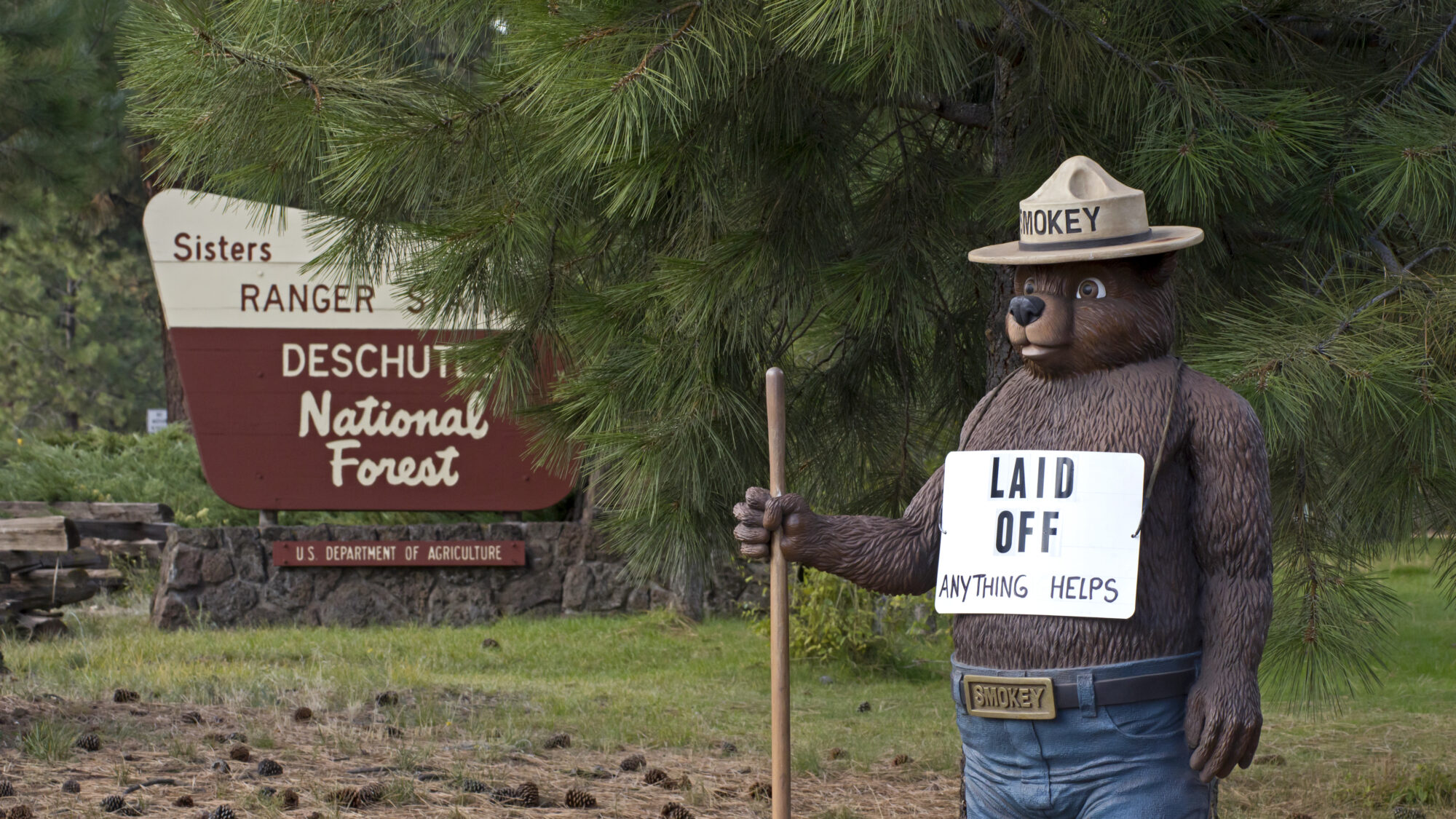 SISTERS, OR - OCTOBER 13: Smokey The Bear outside of US Forest Service office in Sisters, Oregon with Laid Off sign during government shutdown October 13, 2013.