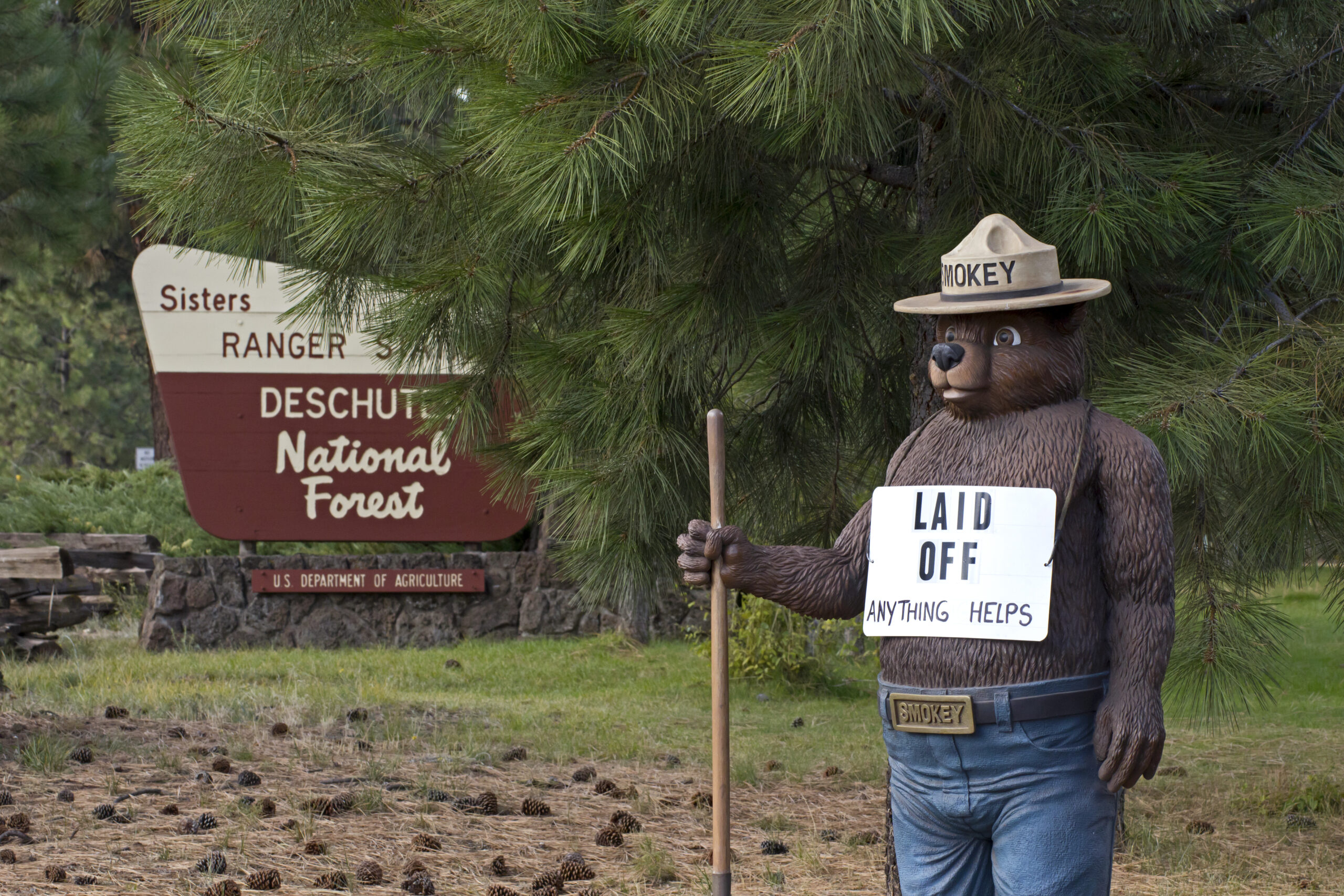SISTERS, OR - OCTOBER 13: Smokey The Bear outside of US Forest Service office in Sisters, Oregon with Laid Off sign during government shutdown October 13, 2013.