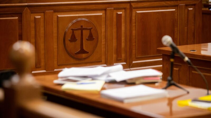 The scales of justice in a courtroom.