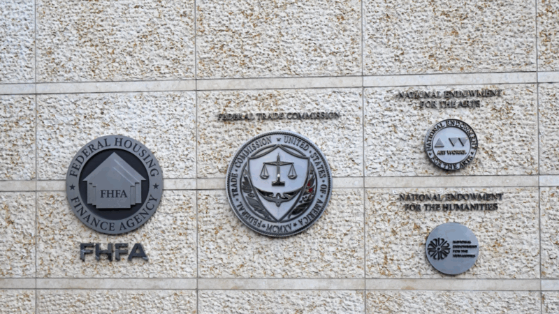 Logos for the FHFA and other federal agencies on a government building.