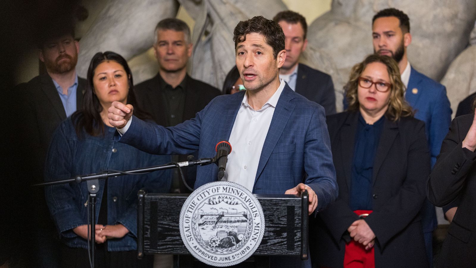 Jacob Frey speaking at a press conference in Minnesota.