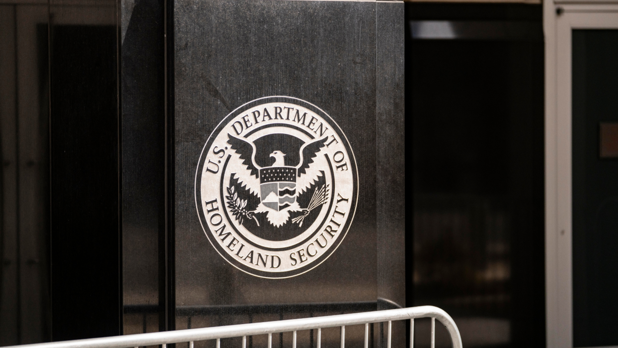The DHS logo on the side of the DHS headquarters.