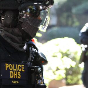 A federal agent in Portland in 2020 with a face mask.