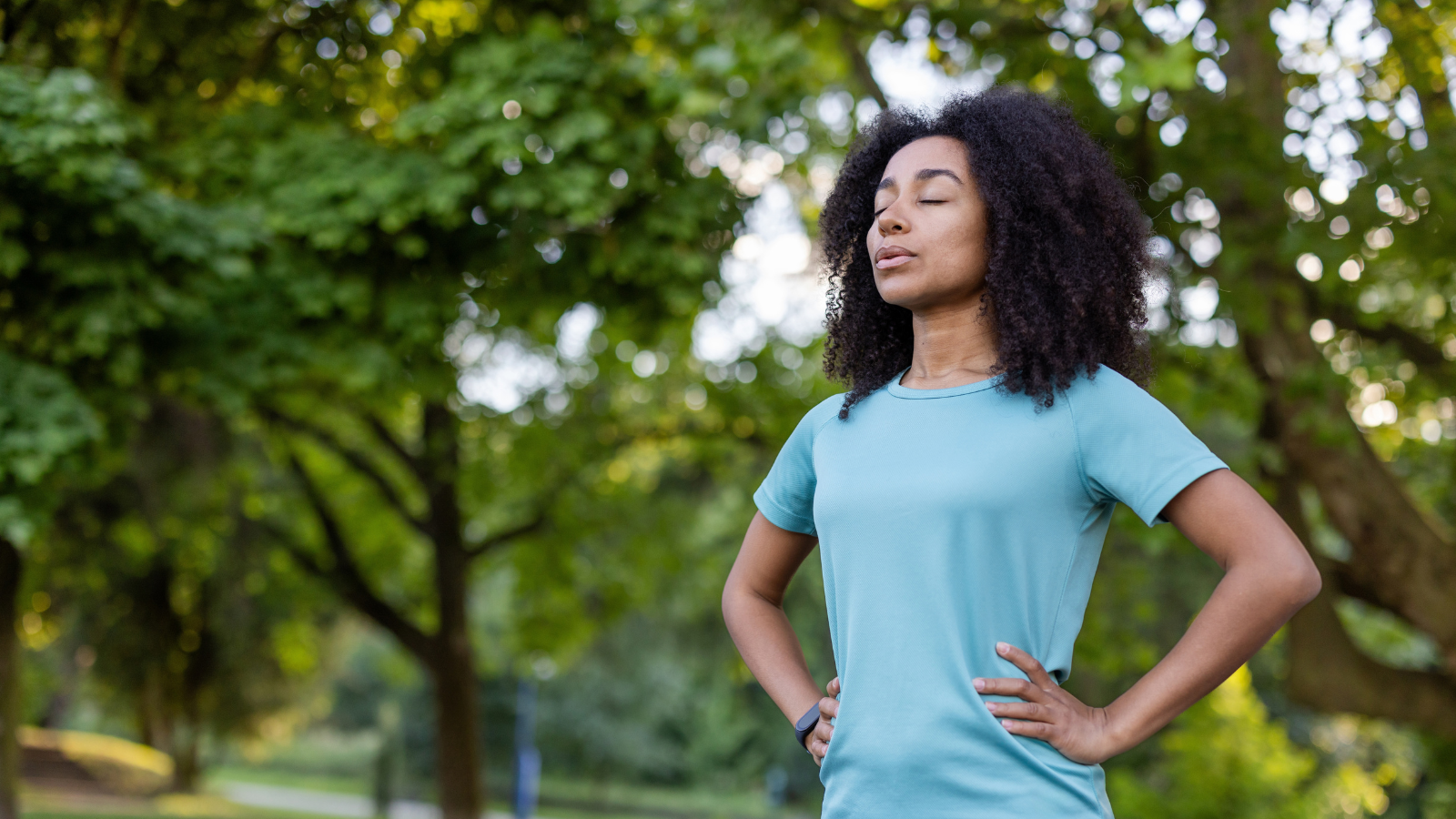 A woman practicing mindfulness outside