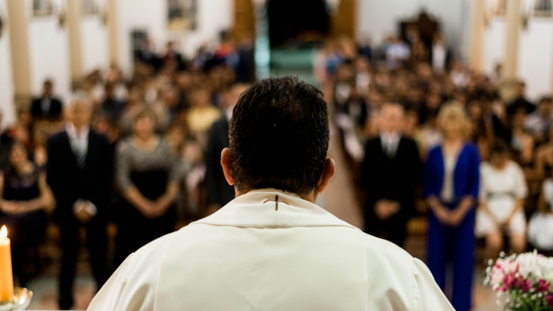 A priest delivering mass to his congregation.