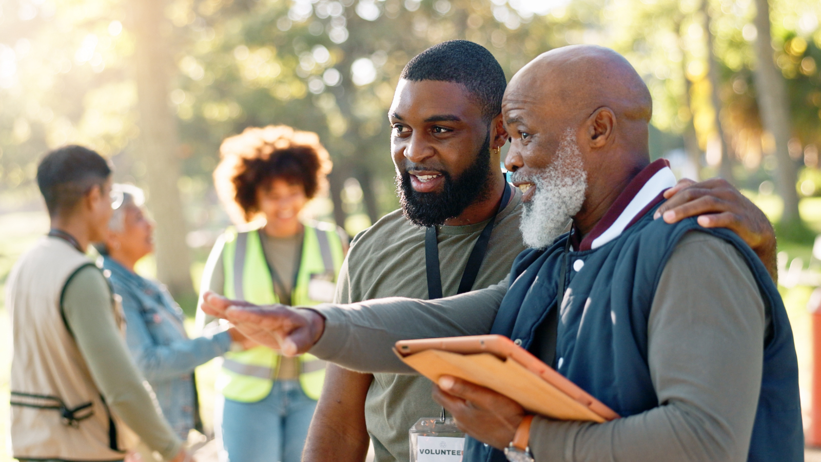 Two volunteers standing next to each other