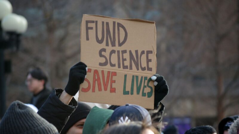 A 'fund science, save lives' protest sign