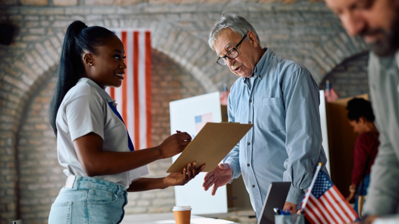 Person working with an election official