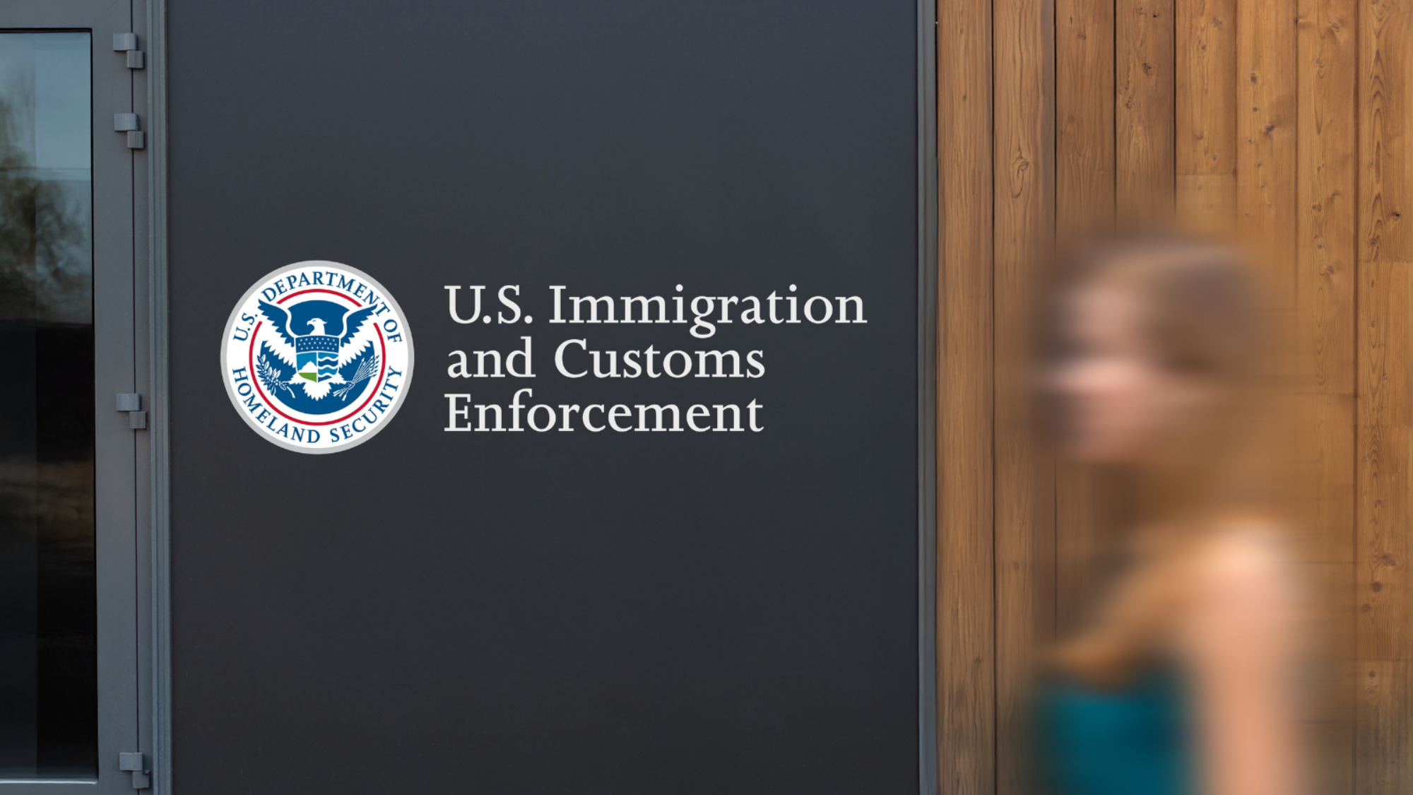 An ICE office with a person walking by it