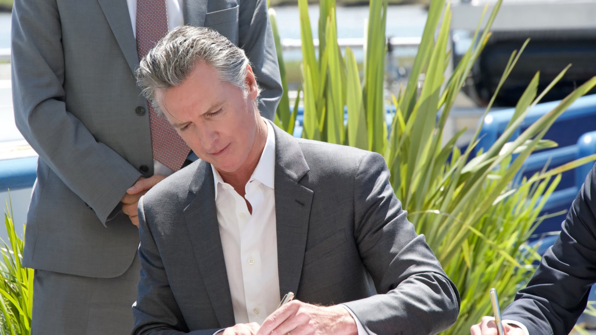 Gavin Newsom signing a bill in 2024